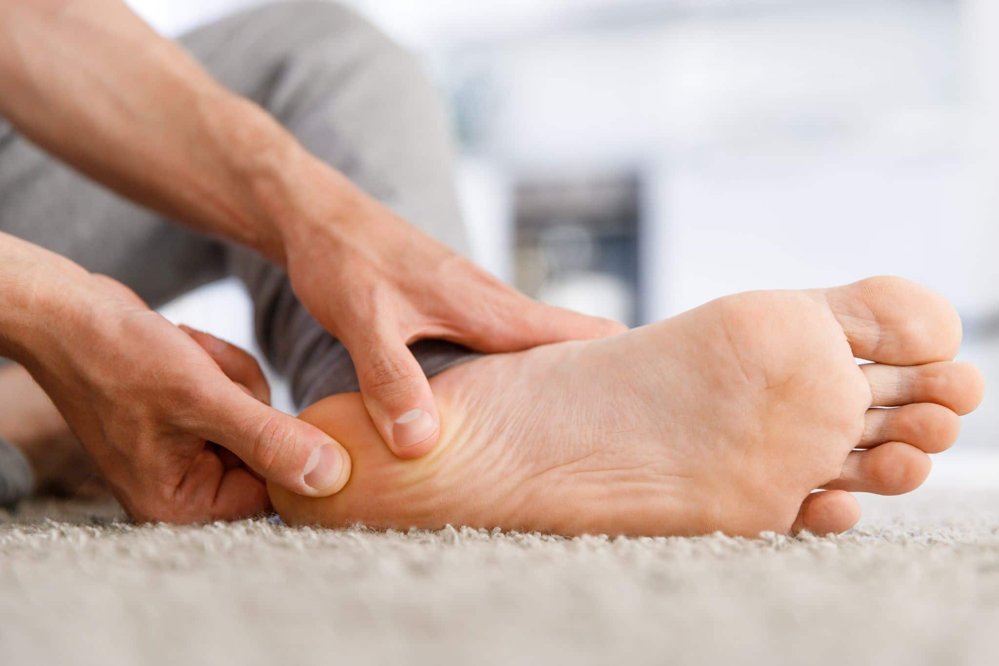 A physiotherapist treating a patient with plantar fasciitis.