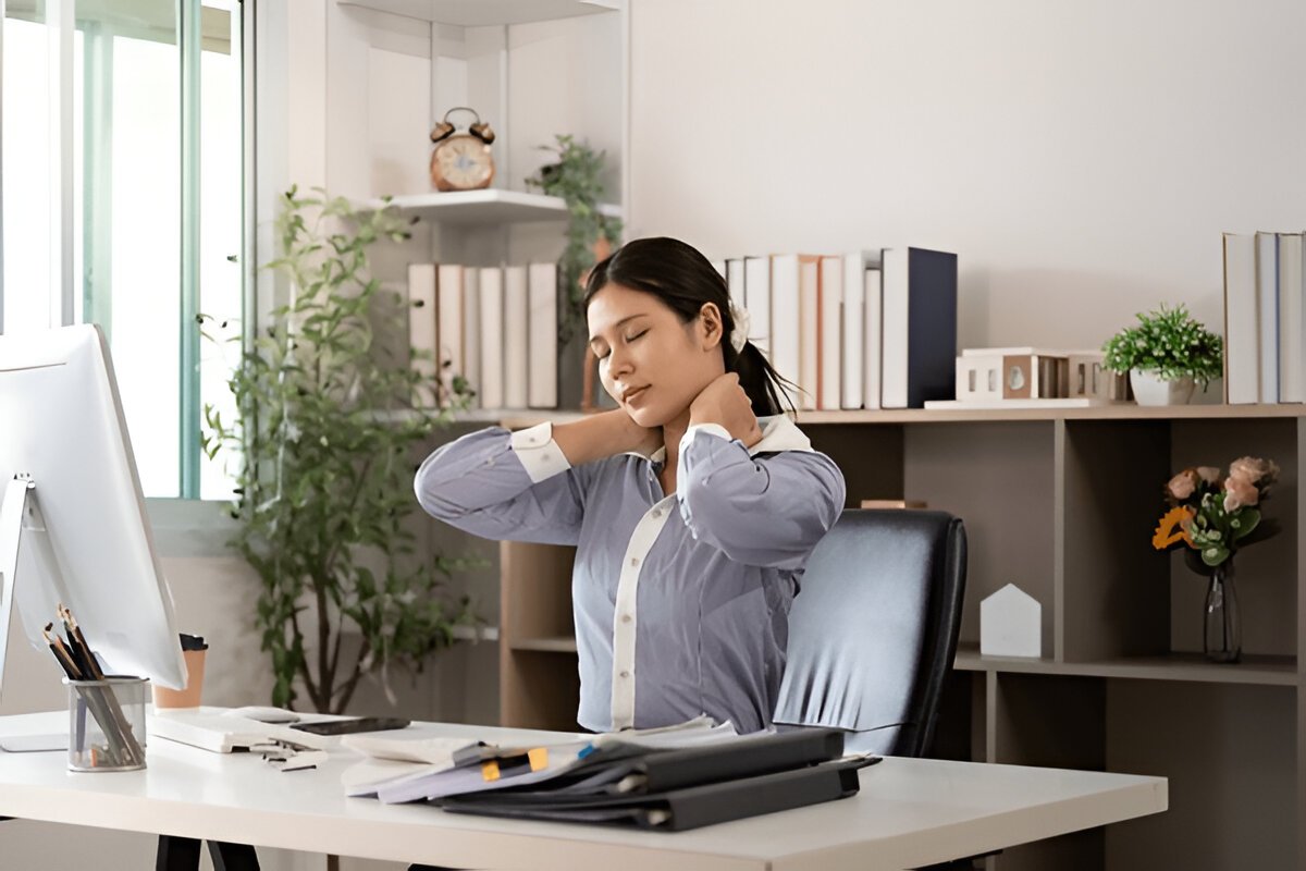 Women having a neck pain while working