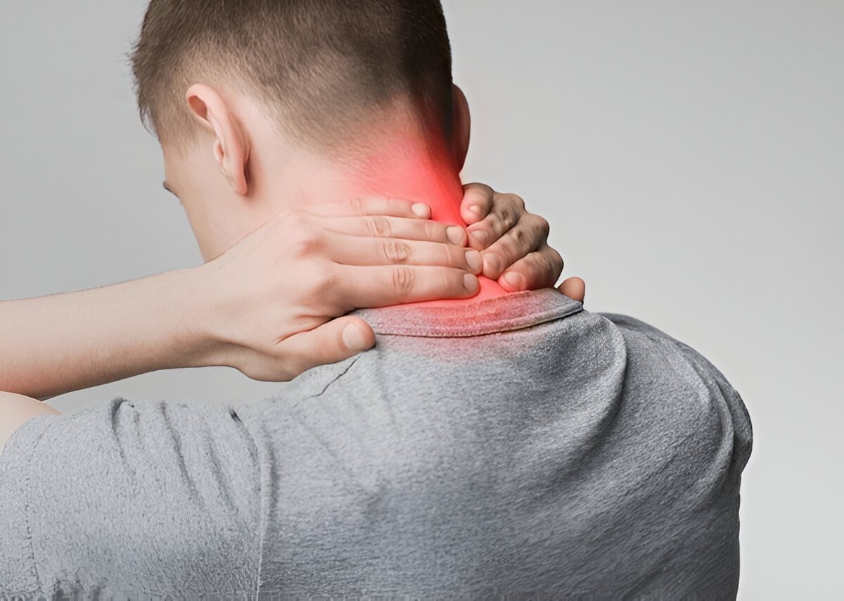 Man holding neck in pain with red area showing inflammation or cervical discomfort