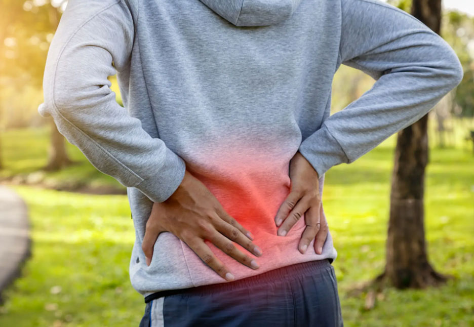 a person Feel Lower Back Pain When Walking in garden