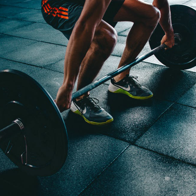 A person performing weight lifting exercises as part of sports injury rehabilitation.